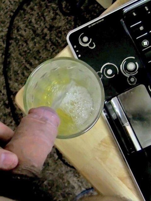 Zack Randall pees in a pint glass then sucks his own uncut cock
