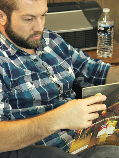 Bearded hunk Jason jerks off to pussy mags and swings his nuts around