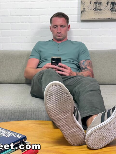 Aaron Boss strips, shows off his feet, and jerks off to a messy cumshot