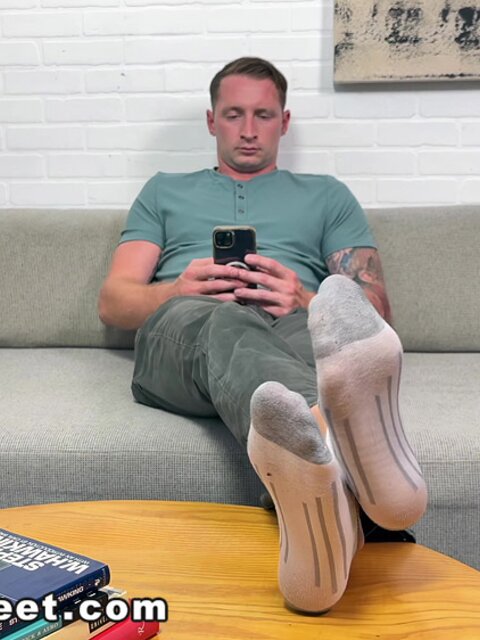 Aaron Boss strips, shows off his feet, and jerks off to a messy cumshot