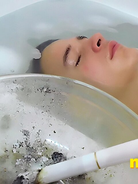 Tristan Sweet relaxes in bubbles, blowing smoke and teasing himself