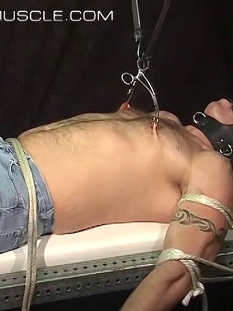 Bigg Pete is tied down and gagged before nipple clamps go on