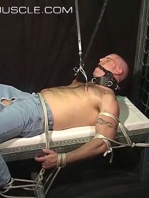 Bigg Pete is tied down and gagged before nipple clamps go on
