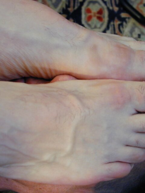 Mr. Pratt tickles Ridgeway’s feet through his sheer socks