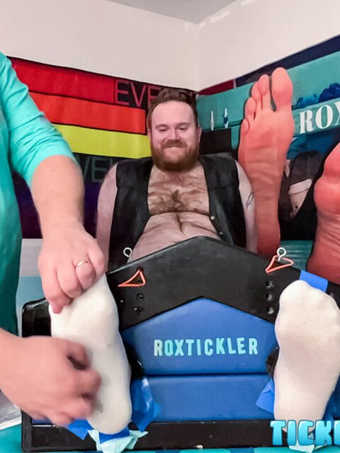Ryan giggles and squirms under Matt’s tickling fingers