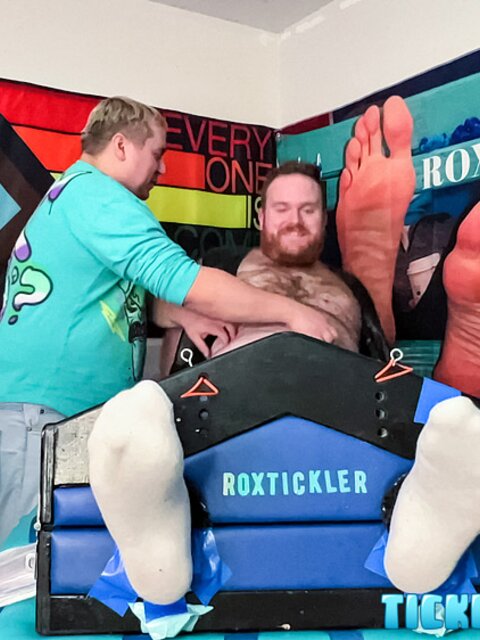 Ryan giggles and squirms under Matt’s tickling fingers