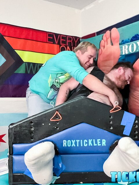 Ryan giggles and squirms under Matt’s tickling fingers