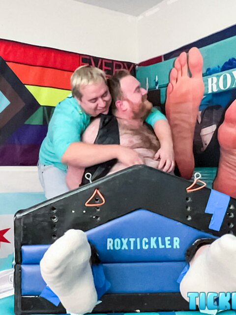 Ryan giggles and squirms under Matt’s tickling fingers