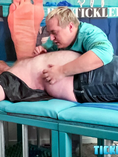 Ryan giggles and squirms under Matt’s tickling fingers