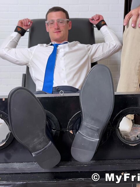 Tommy Parker laughs as pits and feet are tickled by expert