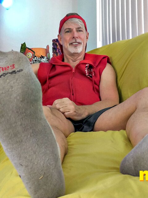 Richard Lennox shows off his sweaty feet and strokes his cock