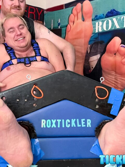 Ryan’s tickling makes Matt giggle and arch his chubby body
