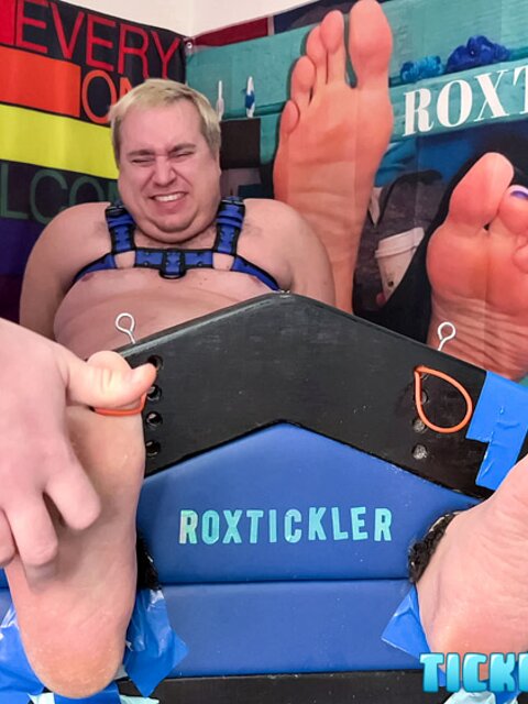 Ryan’s tickling makes Matt giggle and arch his chubby body