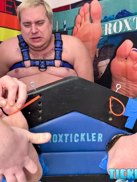 Ryan’s tickling makes Matt giggle and arch his chubby body