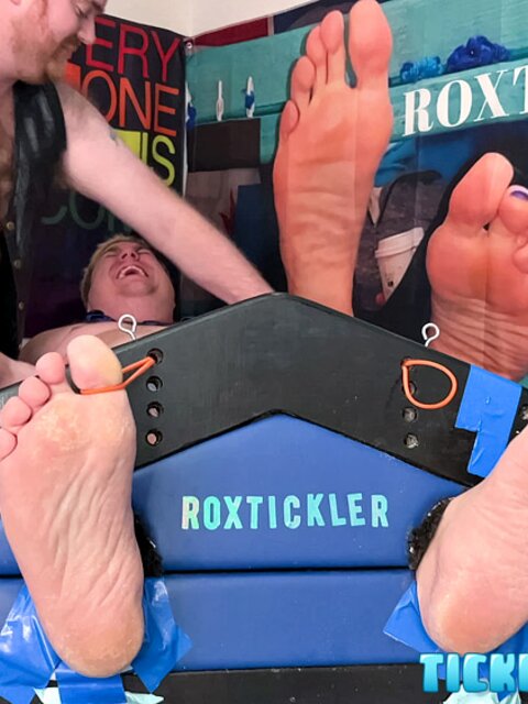 Ryan’s tickling makes Matt giggle and arch his chubby body