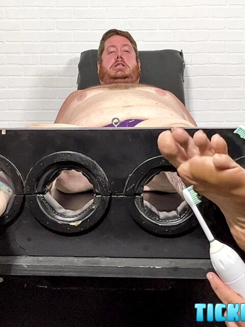Big Red giggles as Matt teases his soles with tools