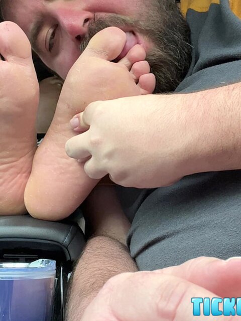 Matt laughs as Nemo licks every spot on his bare feet