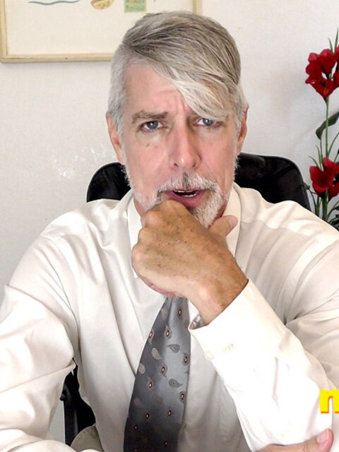 Richard Lennox plays with his cock under his suit in private