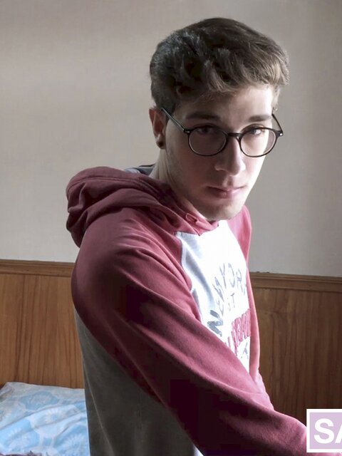 Latino twink Arthur Joseph jerks off and swallows in smooth bedroom shoot