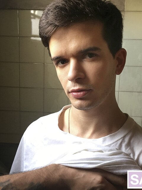 Sebastian licks cum off his lips after getting fucked