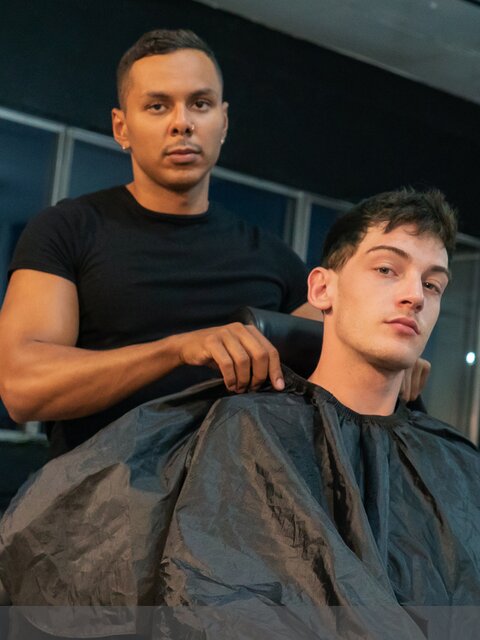 Barber Milo Madera cuts Edward Terrant’s hair then breeds him