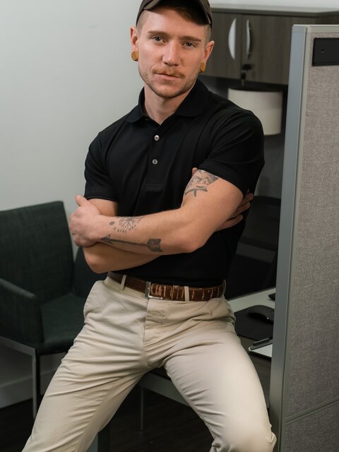 Colt Spence face-fucks officer Seth Corrigan over desk for facial finish