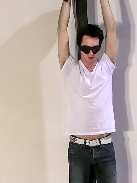 Clint chains blindfolded Trevor and paddles his cock