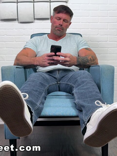 Jean kicks off his shoes and stretches his big size 12 feet after a long day