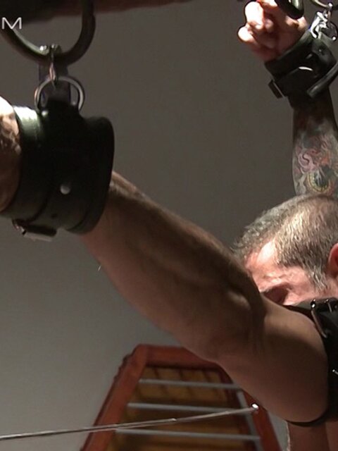 Luke Riley uses electro shocks and his own cock to punish hairy dom Nick Moretti