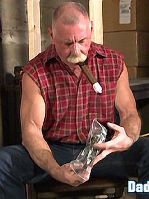 Mature daddy Scott Reynolds smokes a cigar and licks up his own fresh cum load
