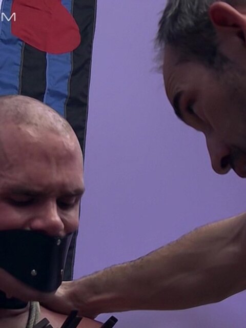 Master Derek Da Silva rips clothespins from pup Cullen Cable’s sensitive skin