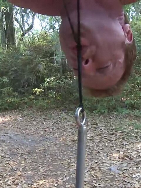 Derek Pain hangs upside down while Mulengro torments his sensitive nipples with heavy weights