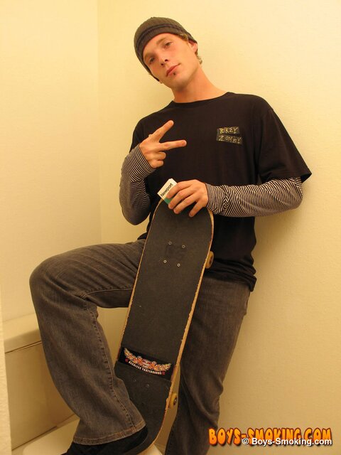 Skater boy Viper jerks his thick dick while smoking Newports in the bathroom