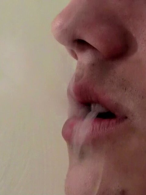 Military boy Leo McArthur strips down and smokes while stroking his hard dick