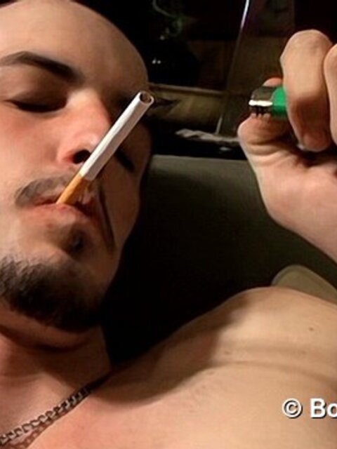 Rocker Axel smokes two cigarettes at once while playing guitar and jerking off