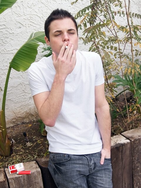 Dustin Fitch chainsmokes outdoors while stroking his big twink dick
