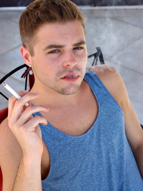 Dustin Fitch chainsmokes menthols and blows a thick load on his stomach