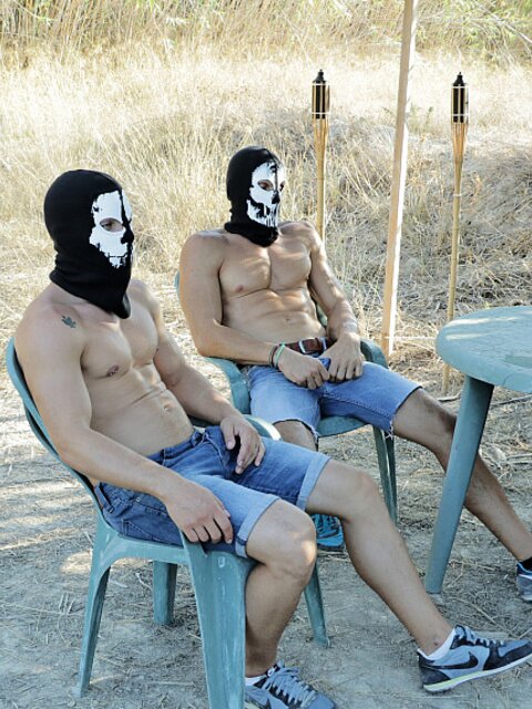 James Oakleigh gets caged, pissed on and used by two masked hunks outdoors