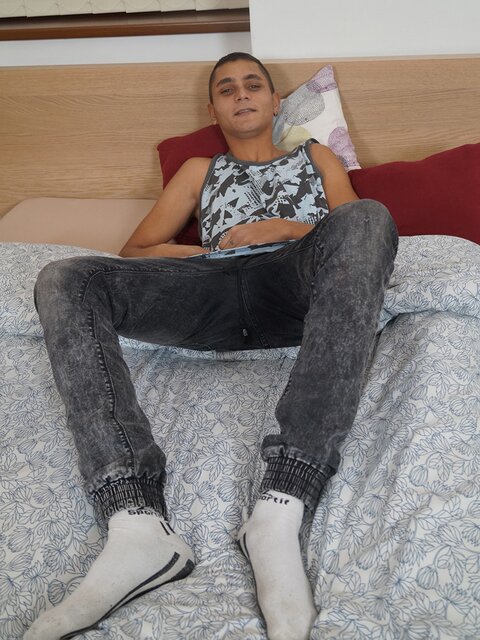 Slim young twink Eli Sterling strokes his smooth skin to a messy climax