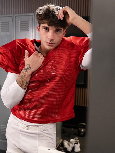 Coach Ed Steel pulls quarterback Leo Levine into his office for sex