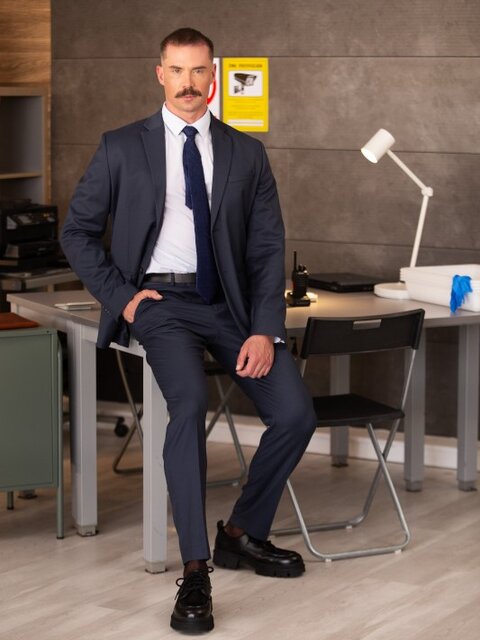 Security guard Beau Butler gives Adam Tyrant an intimate office search