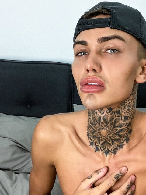 Tattooed twink Logan strips down to his jockstrap for a messy solo show