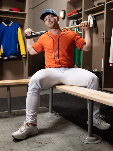 Coach Johnny Donovan gives player Damian Night a wild hands-on locker lesson